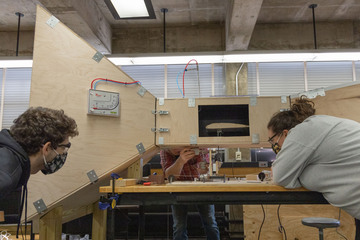 Students work on the wind tunnel